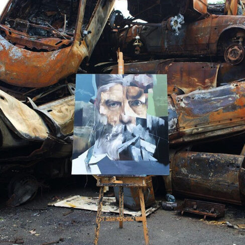 photos of "Oberig" artwork by Yevhenii Shapovalov in Bucha, on a back of damaged cars