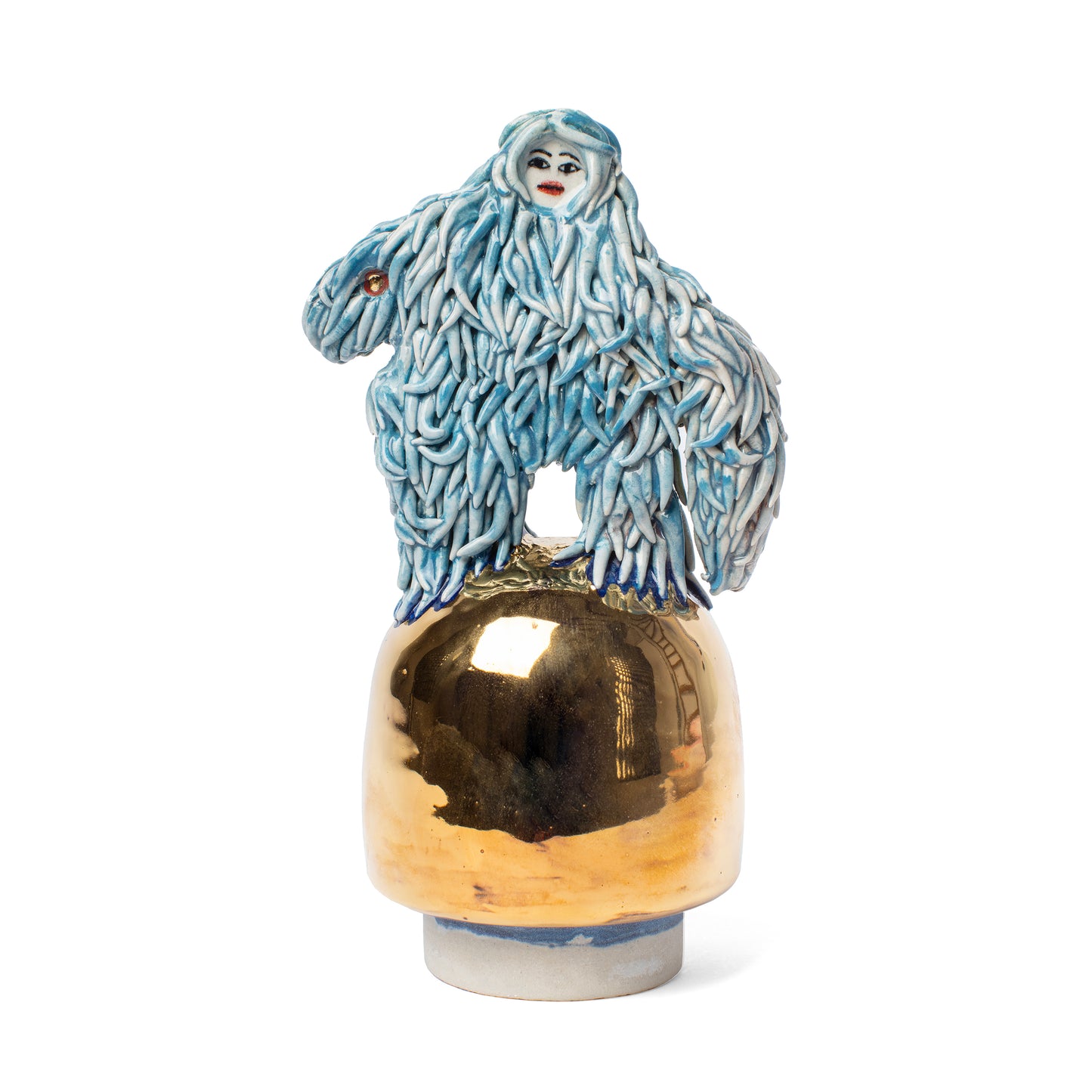 Decorative vase top with a blue and white creature on top of a gold-colored base.