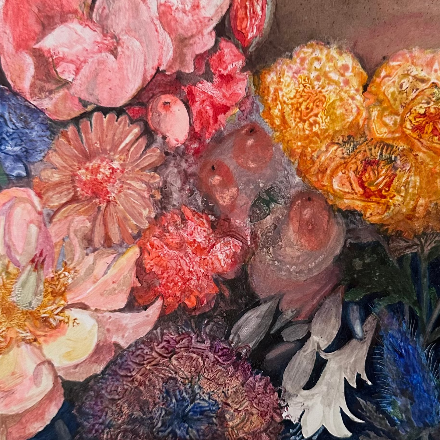 Close-up of colorful flowers with a blurred face in the background