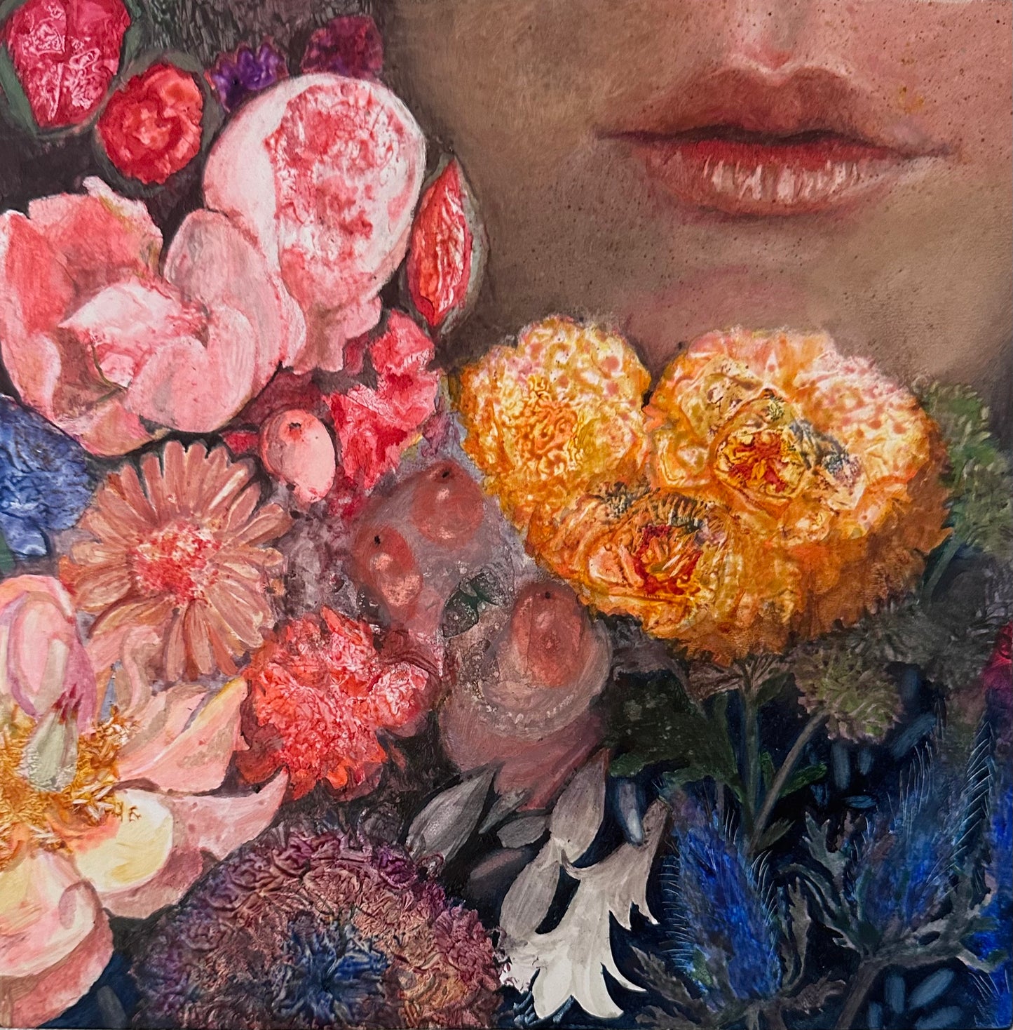 Close-up of colorful flowers with a blurred face in the background