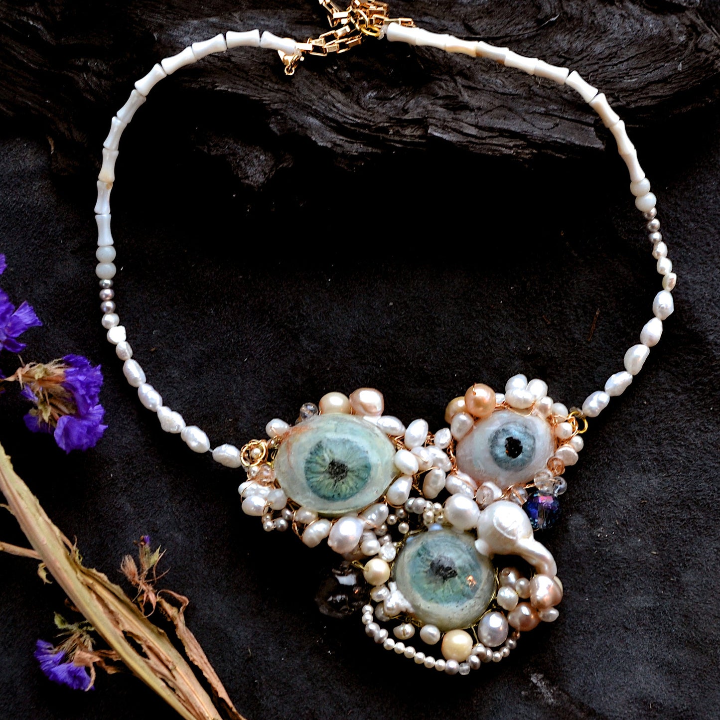 Necklace with decorative elements on a dark surface