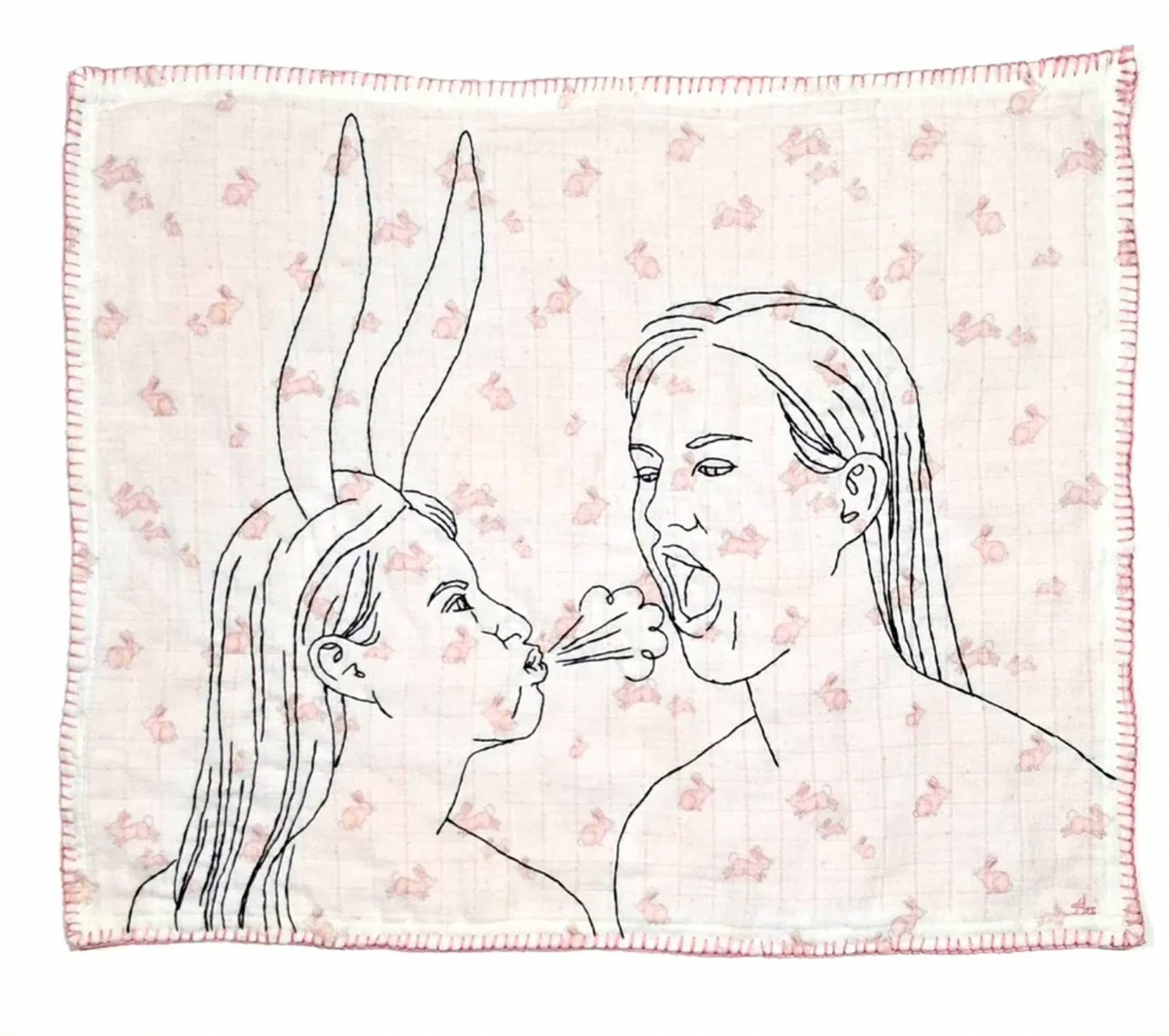 Blanket with line art of two faces and a flower on a floral patterned background