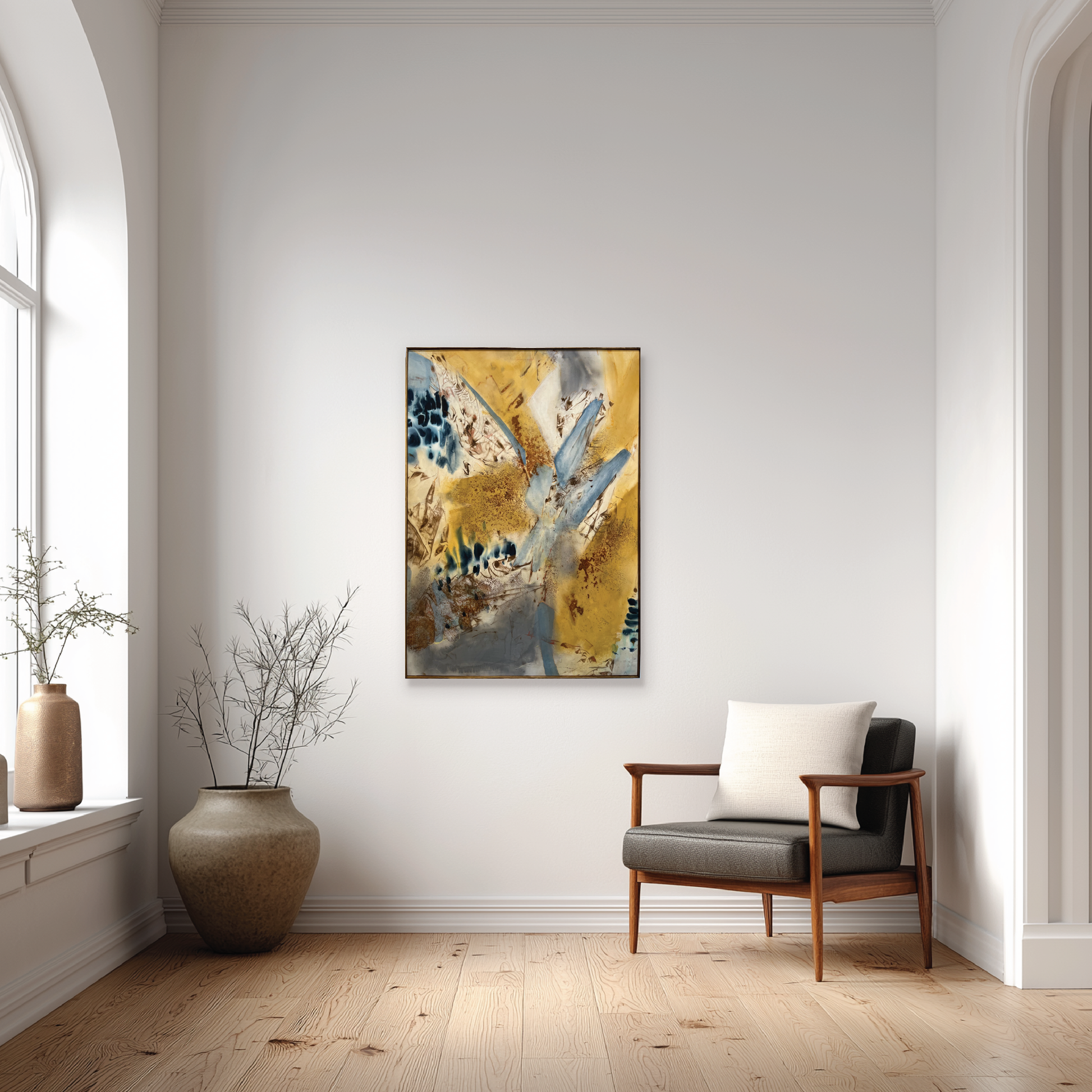 Modern living room with abstract art, chair, and decorative items.