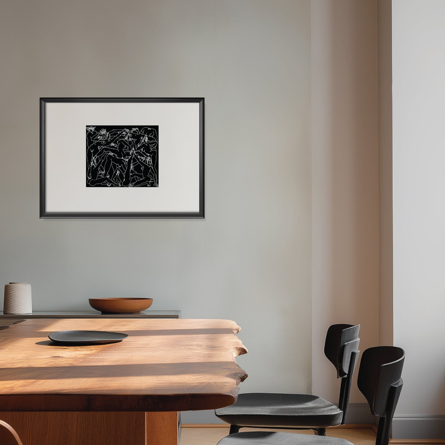 Dining room with wooden table, black chairs, and abstract art on the wall.