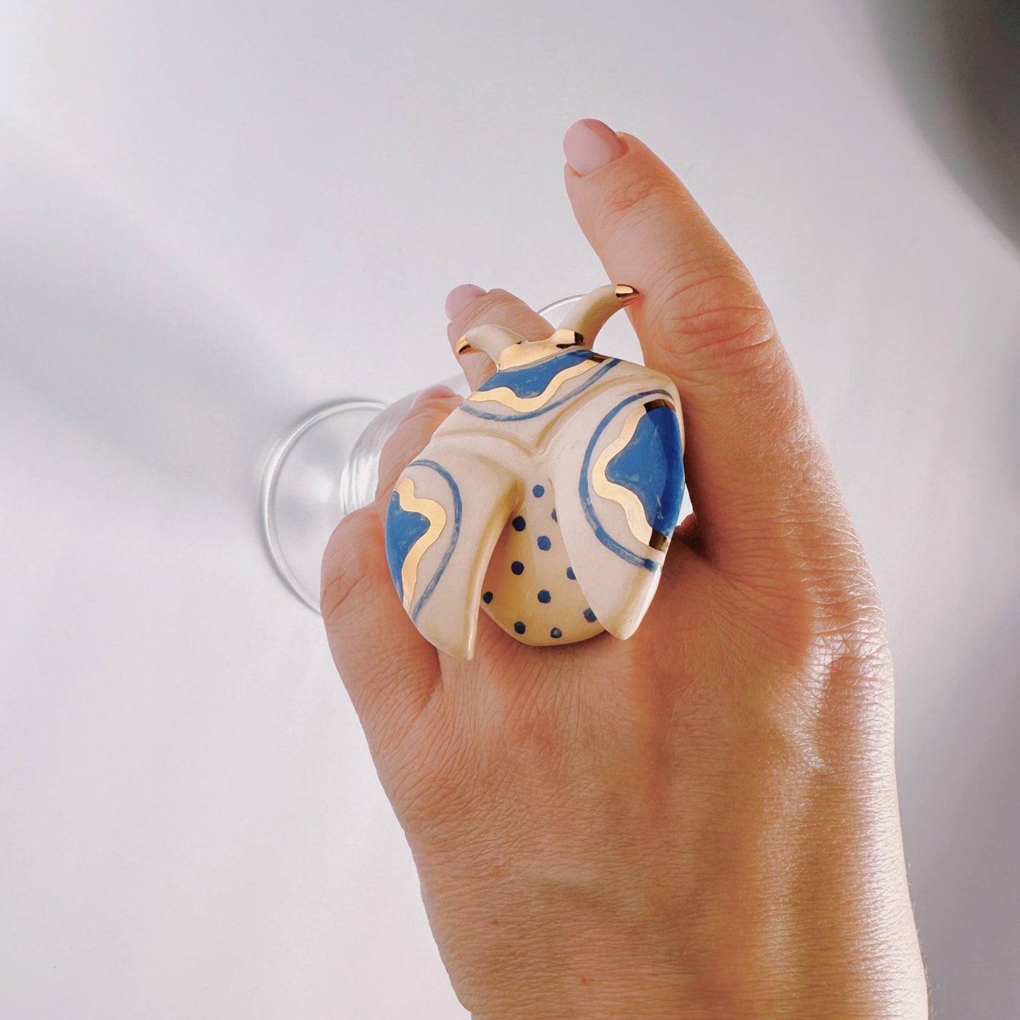 the ceramic elegant ring 17 on the hand by Yuliia Pylypchatina