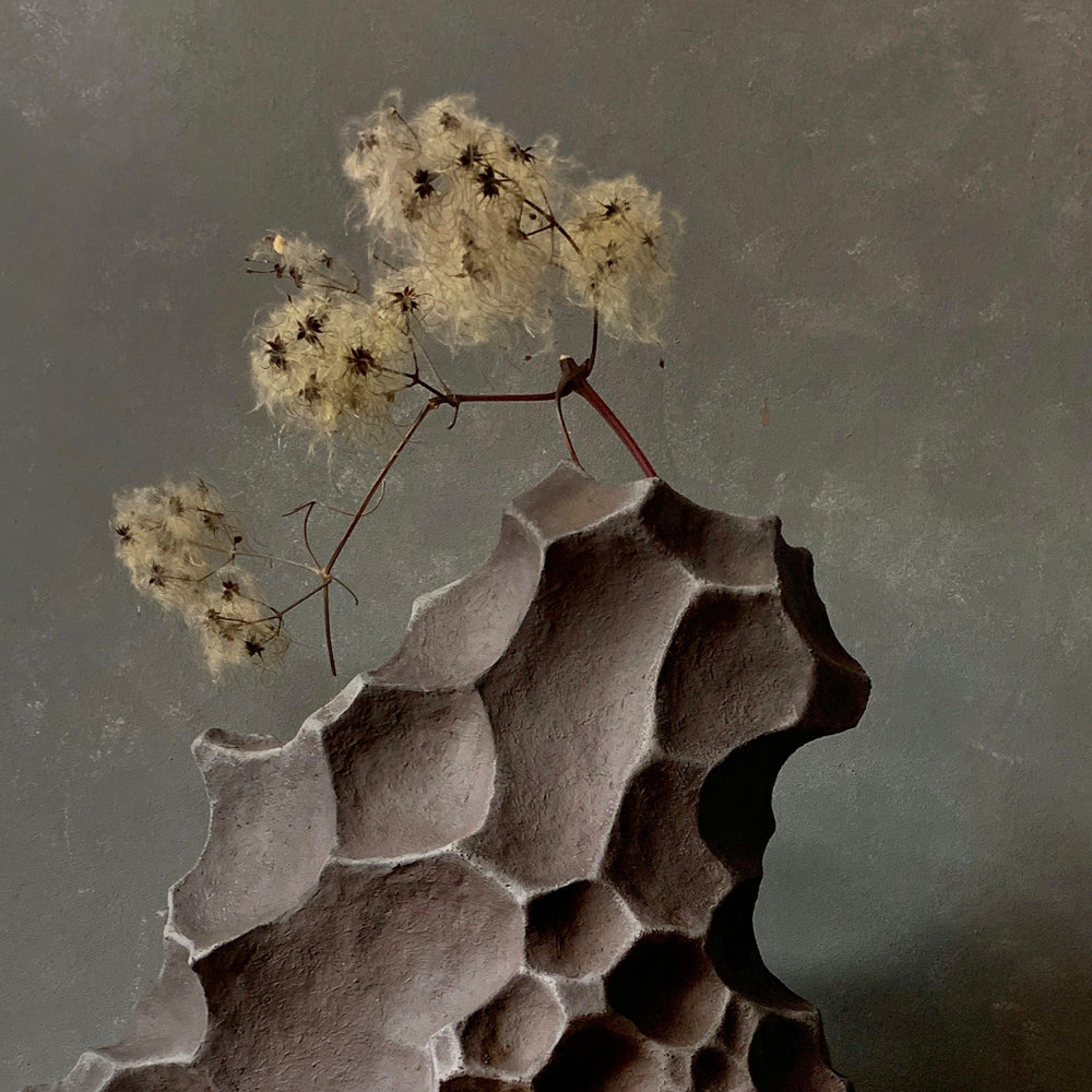 Contemporary ceramic vase in organic sculptural form with natural earth-toned glaze by NaturaCeramica, close up 1
