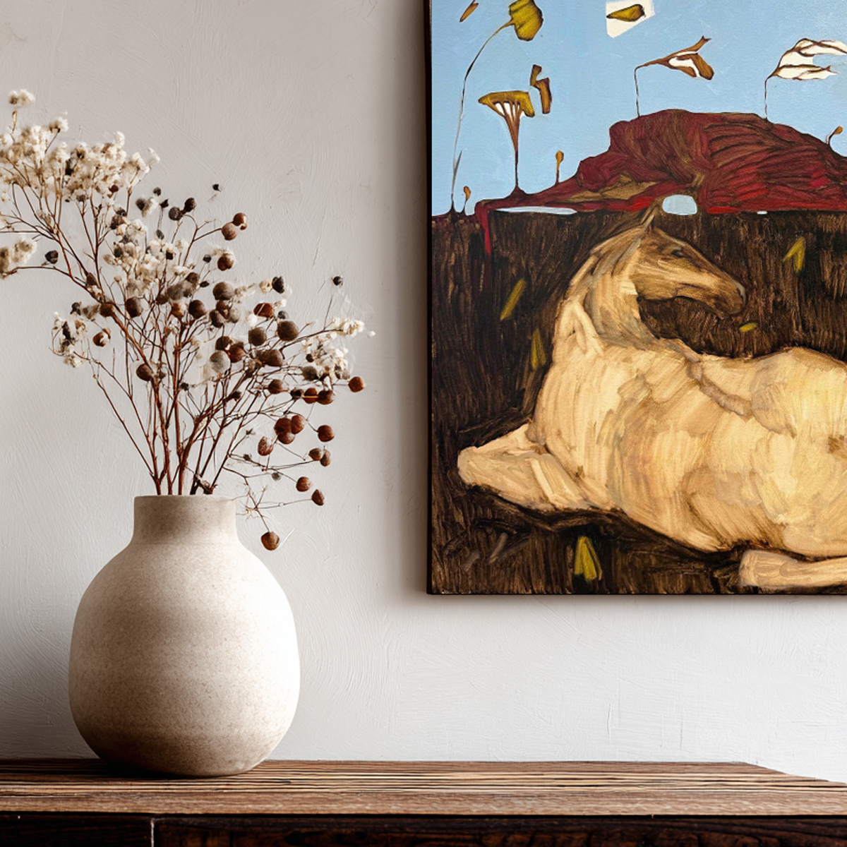Vase with dried flowers on a wooden shelf next to an abstract painting by Anna Bondar