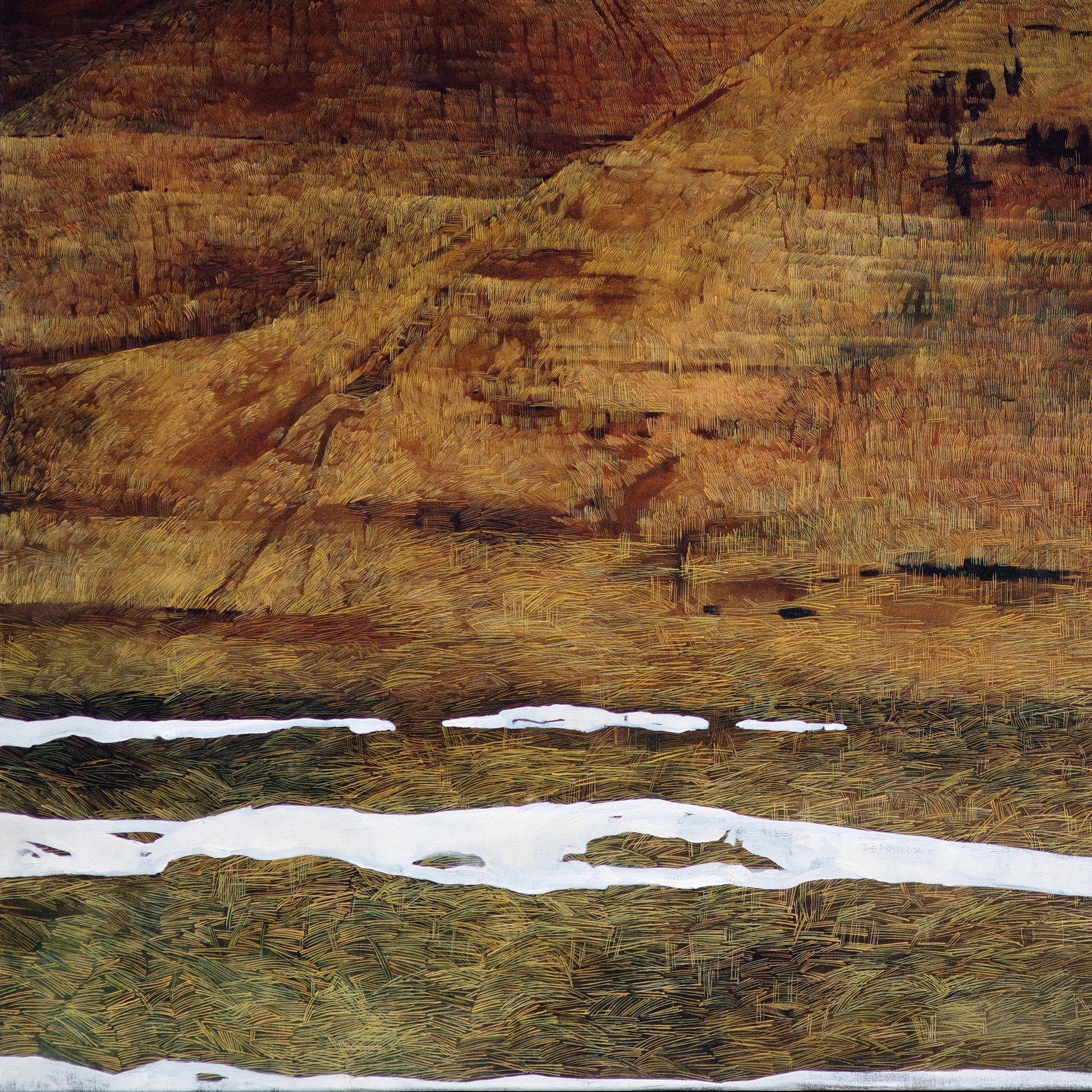 Winter Hilly landscape with snow patches under a blue sky