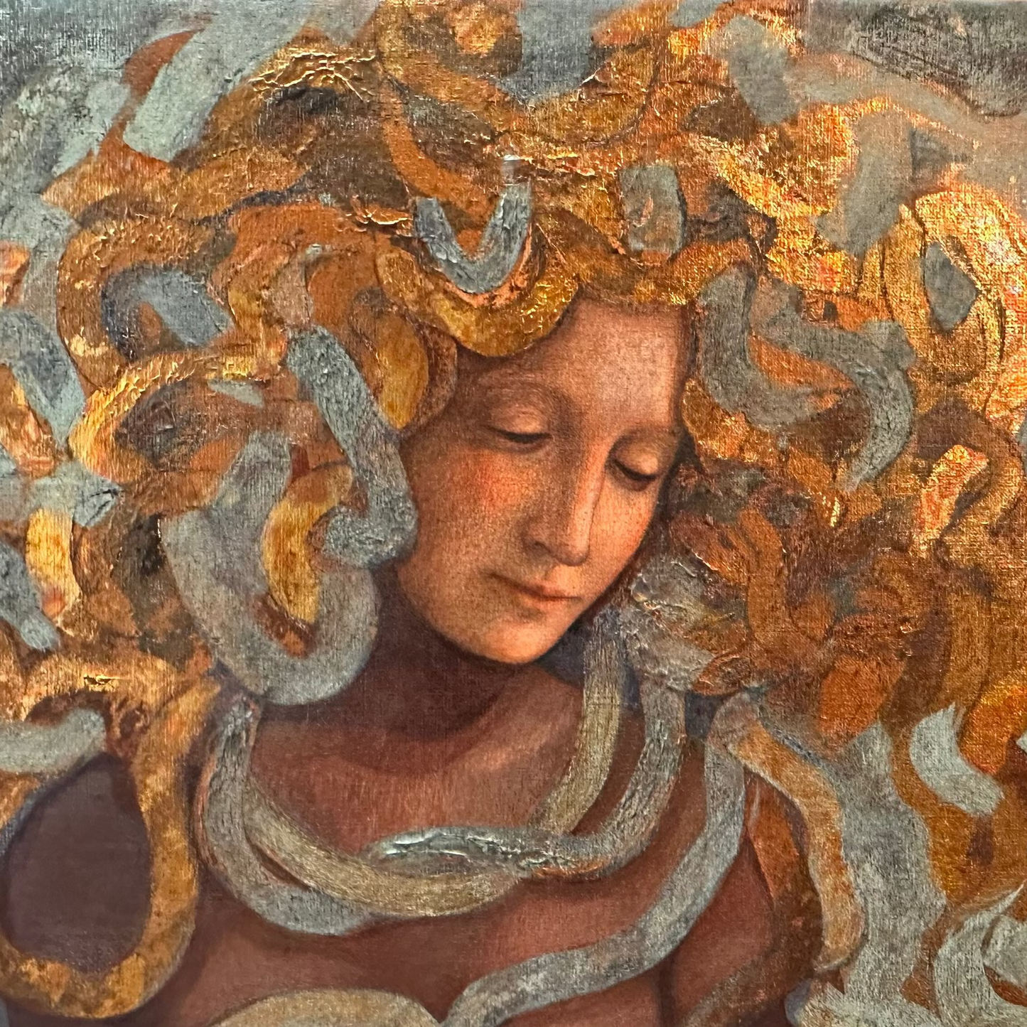 Meduza, Artistic depiction of a woman with intricate, swirling patterns around her head and neck.