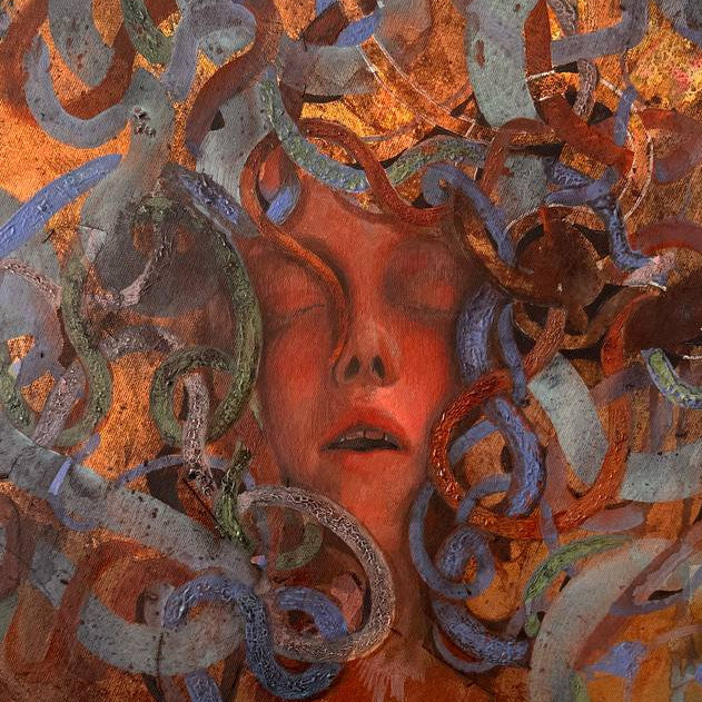 Medusa, artwork with a stylized face and swirling patterns on a white wall.